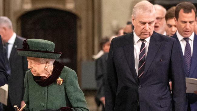 Britain's Queen Elizabeth II, left, was walked in by Prince Andrew to a Service of Thanksgiving for Britain's Prince Philip, Duke of Edinburgh, on March 29, almost a year after his death. Picture: Richard Pohle/AFP