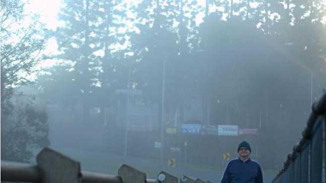 DEDICATED: Peter Bosse, crossing Kidd Bridge, went for his regular morning walk despite the plummeting temperatures. Picture: Frances Klein