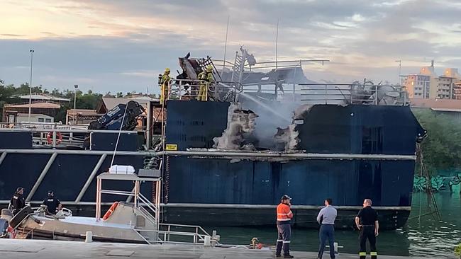 The 24m MV Guru went up in flames in a fire at Hornibrook’s Wharf in Frances Bay Wednesday morning, which sent choking plumes of smoke across the Darwin CBD. Picture: NT News