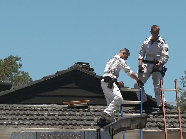 Rescuers at the scene of the tragedy in Eagle Vale. Picture: TNV