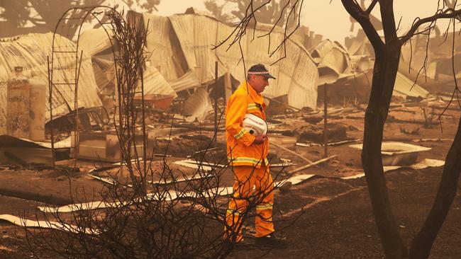 CFA fire chief Steve Warrington at a destroyed house in Buchan. Picture: David Crosling