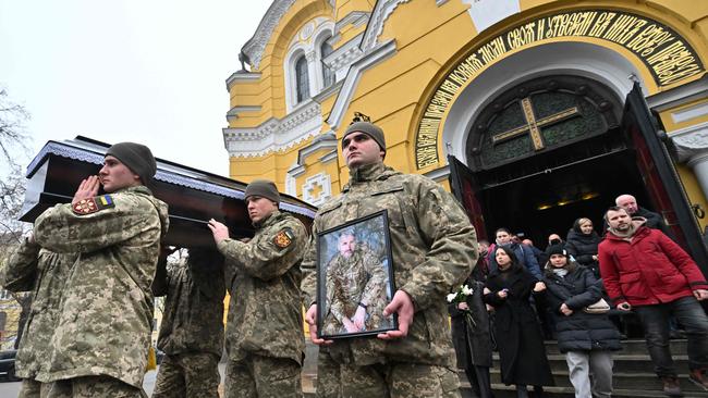 Soldiers carry a coffin with the body of Volodymyr Yezhov, Ukrainian serviceman killed with the fighting against Russian troops in town of Bakhmut.