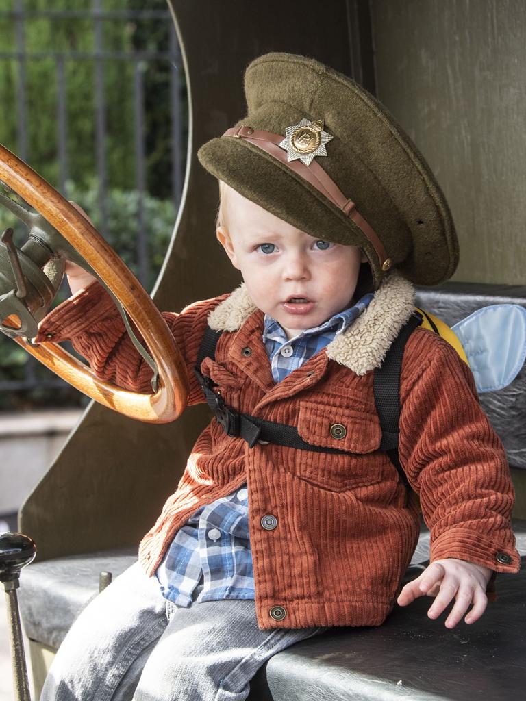 Liam Keller 18 months old, behind the wheel of his fathers (Ed Keller) WW1 Model T Ford truck. Only one in Australia and one of four in the world. Assembly in Neil St for the mid morning parade on ANZAC DAY. Tuesday, April 25, 2023. Picture: Nev Madsen.