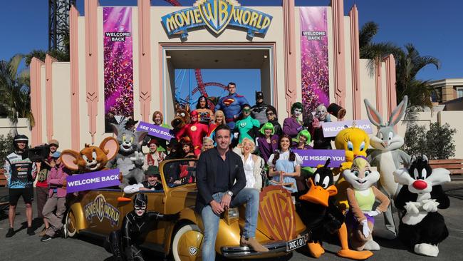 Movie World CEO Clark Kirby and workers celebrating the reopening of Movie World. Picture: Glenn Hampson