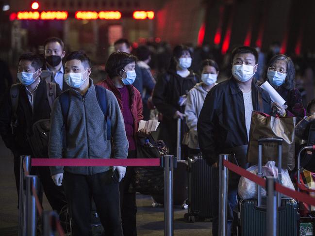 WUHAN, CHINA - April 07: CHINA OUTPassengers line up to enter Wuchang railway station on April 7,2020 in Wuhan, Hubei Province, China. The Chinese government lifted travel restrictions from April 8, after almost 11 weeks of lockdown to stem the spread of COVID-19. (Photo by Getty Images)