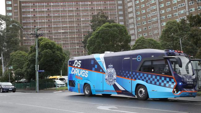 A booze bus out the front of public housing towers in North Melbourne. Picture: David Crosling