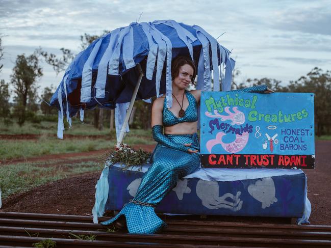 Janie Gibson, dressed in a mermaid outfit, chained to a cattle grid prevents workers from entering the BMD work camp and continuing work on the Adani railway corridor.