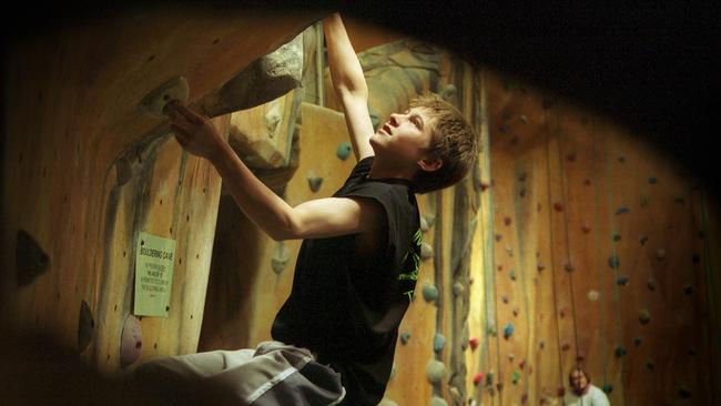 Young rock climber Tomas McGruer Fraser, 14, takes on the bouldering section at Hardrock Indoor Rock Climbing Centre in Nunawading.