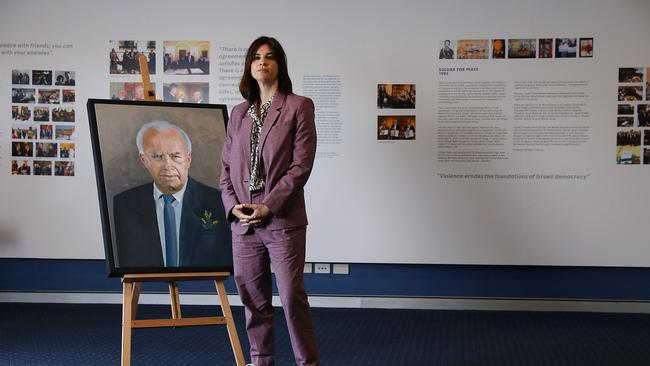 Curator Alexandra Hillman with portrait of Yitzhak Rabin. Picture: Jane Dempster/The Australian.