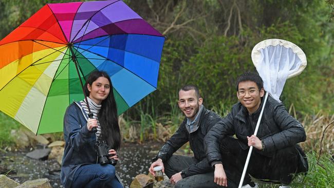 Flinders University ecology researcher, PhD candidate Seamus Doherty (centre) with students from the Australian Science and Mathematics School, Nicole Jefferies (left) and Sean Doan (right), searching for life. Picture: Tom Huntley