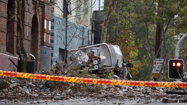 Falling masonry around a damaged ute at the scene. Picture: John Grainger