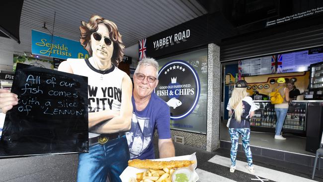 Alan Bray, owner of Yabbey Road Fish &amp; Chips in Redcliffe kept his customers happy and fed while adhering to strict social distancing. Picture: Renae Droop