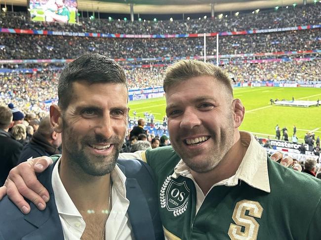 Dricus du Plessis (R) with Novak Djokovic (L) at the 2023 Rugby World Cup final. Picture: Supplied