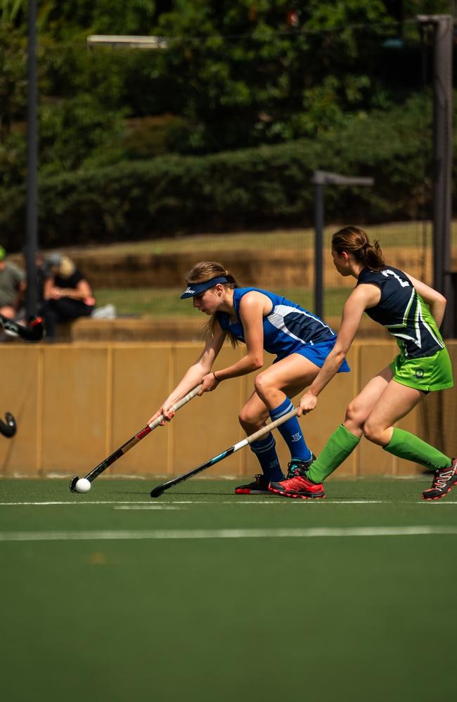 Carissa Graham playing hockey for BGGS.