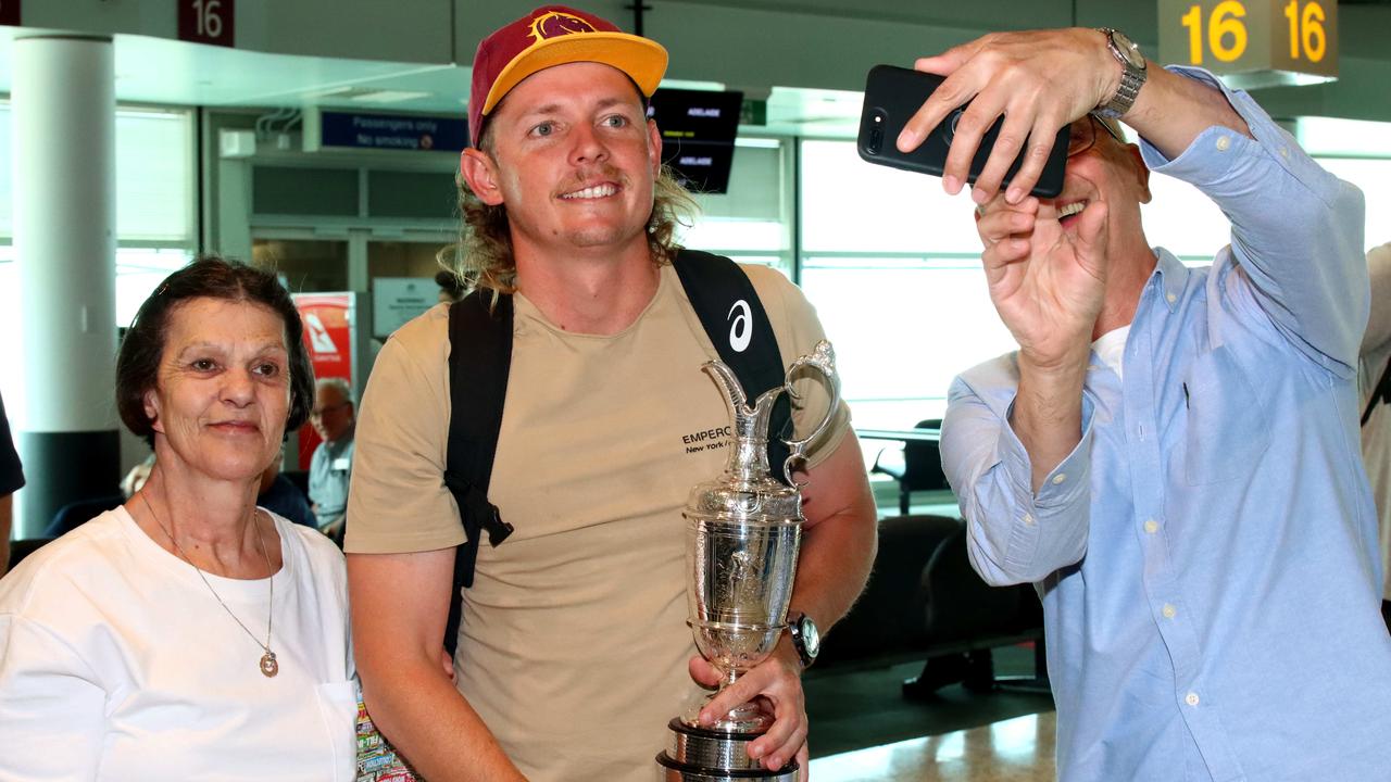 Australian golfer Cameron Smith takes a picture after arriving back in Brisbane. Picture David Clark