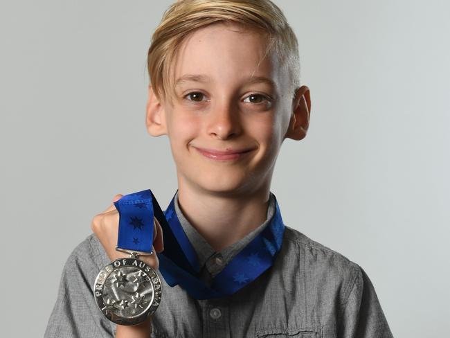 Cael shows off his well-deserved Pride of Australia medal. Picture: Naomi Jellicoe