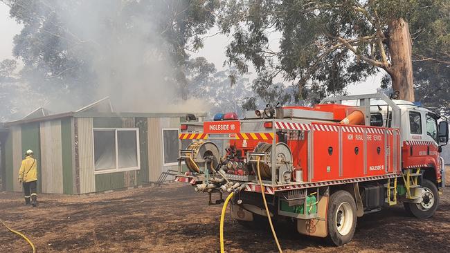 Ingleside Rural Fire Brigade tanker 1B outside the burning home at Bendalong. Picture: Ingleside RFS