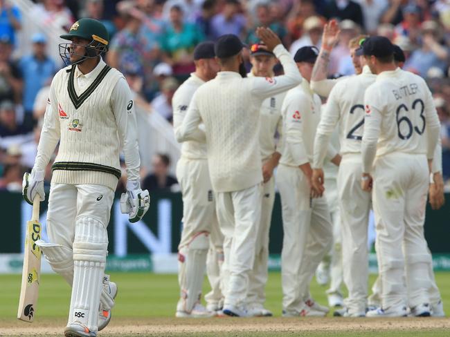 Australia's Usman Khawaja (L) walks back to the pavilion after losing his wicket for 40 during play on the third day of the first Ashes cricket test match between England and Australia at Edgbaston in Birmingham, central England on August 3, 2019. (Photo by Lindsey Parnaby / AFP) / RESTRICTED TO EDITORIAL USE. NO ASSOCIATION WITH DIRECT COMPETITOR OF SPONSOR, PARTNER, OR SUPPLIER OF THE ECB