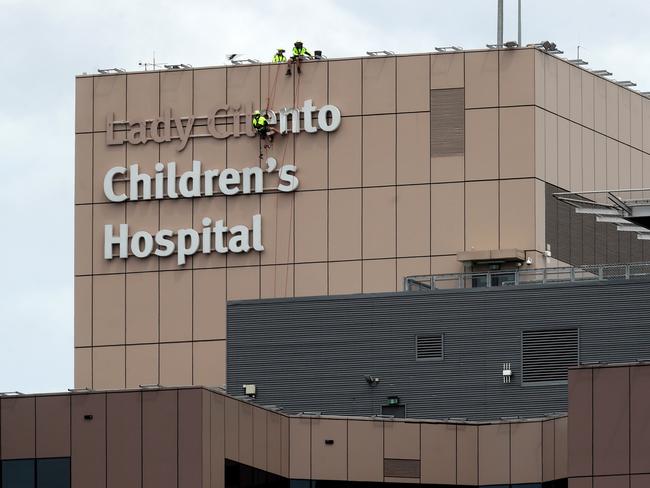 The Lady Cilento Children's Hospital sign getting removed. Pics Tara Croser.