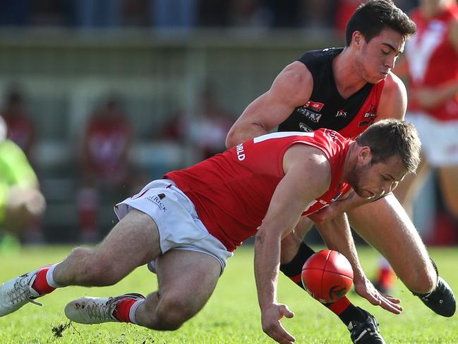 14/5/16 SANFL: Jay Shannon of North tackled by Jack Agostino of West. West Adelaide v North Adelaide at Richmond Oval. Picture by Matt Turner.