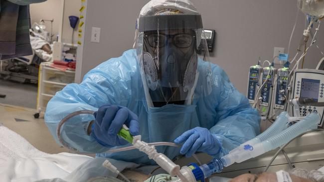 A medical staff member extracts sputum from a patient in the COVID-19 intensive care unit (ICU) at the United Memorial Medical Center in Houston, Texas. Picture: AFP