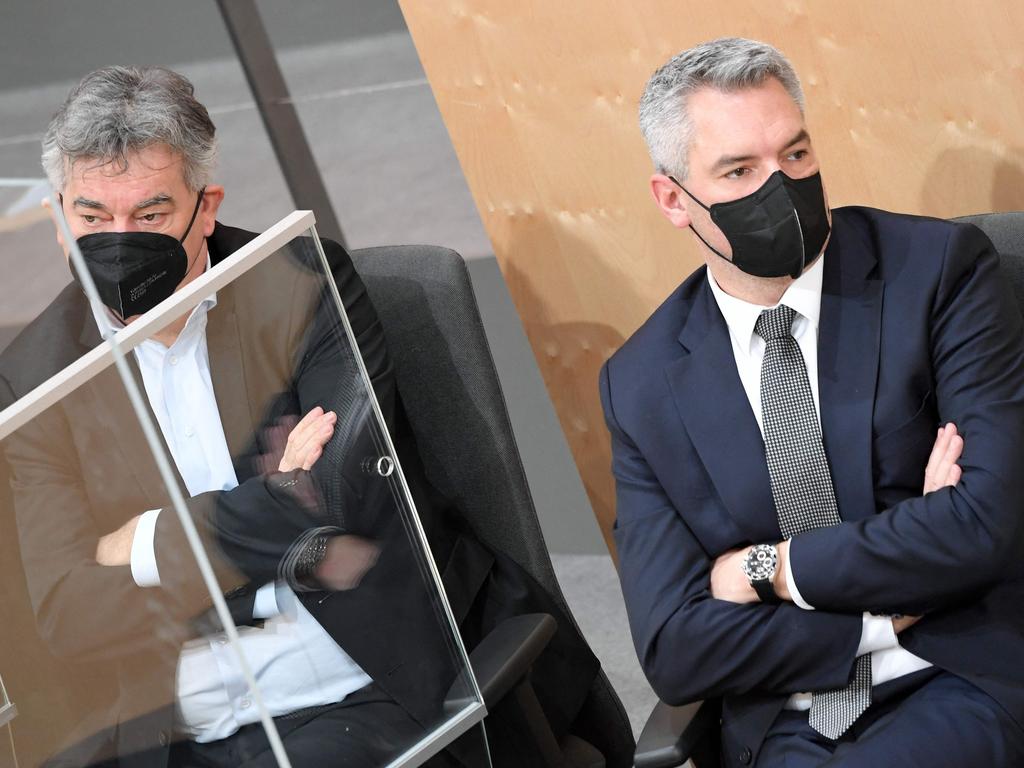 Austria’s vice chancellor Werner Kogler, left, and chancellor Karl Nehammer. Picture: Roland Schlager/APA/AFP