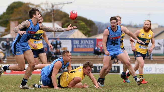 Jake Sutcliffe juggles the footy as players tumble. Picture: AAP/Emma Brasier