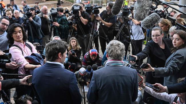 Journalists Chris Masters (centre R) and Nick McKenzie (centre L) talk to the media outside the Federal Court of Australia. The judgment in the Ben Roberts-Smith defamation case was a clear victory for Nine Newspapers and serious daily news journalism in Australia. Picture: Saeed Khan