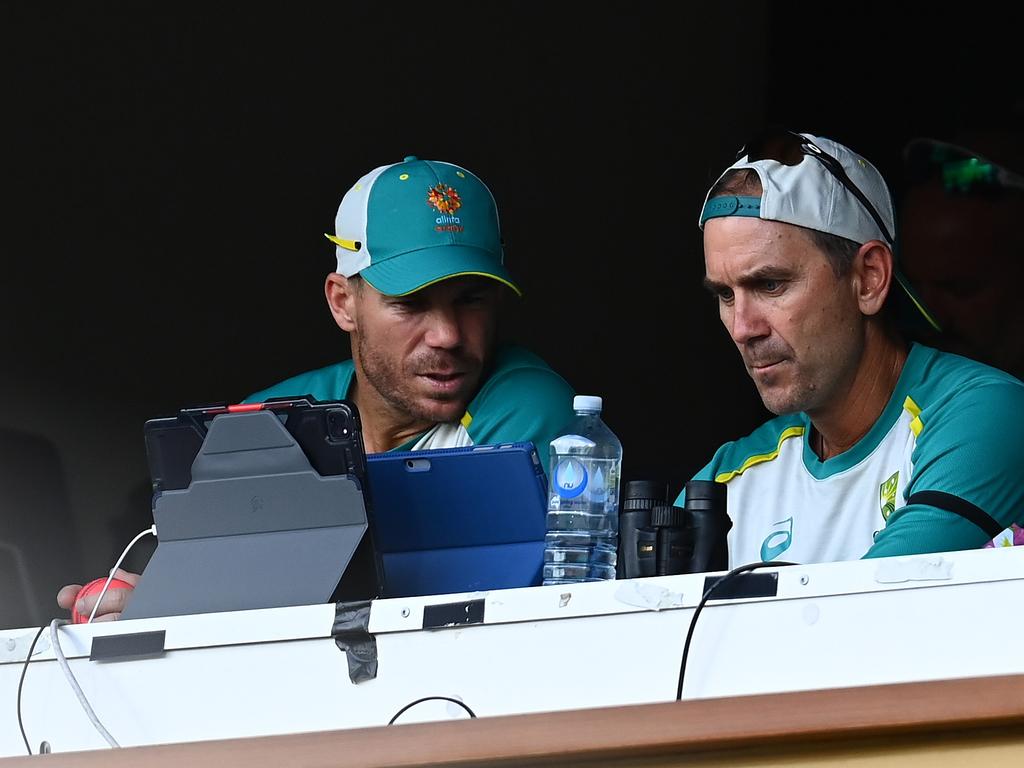 David Warner and the national coach during day two of the Adelaide Test. Picture: Getty Images