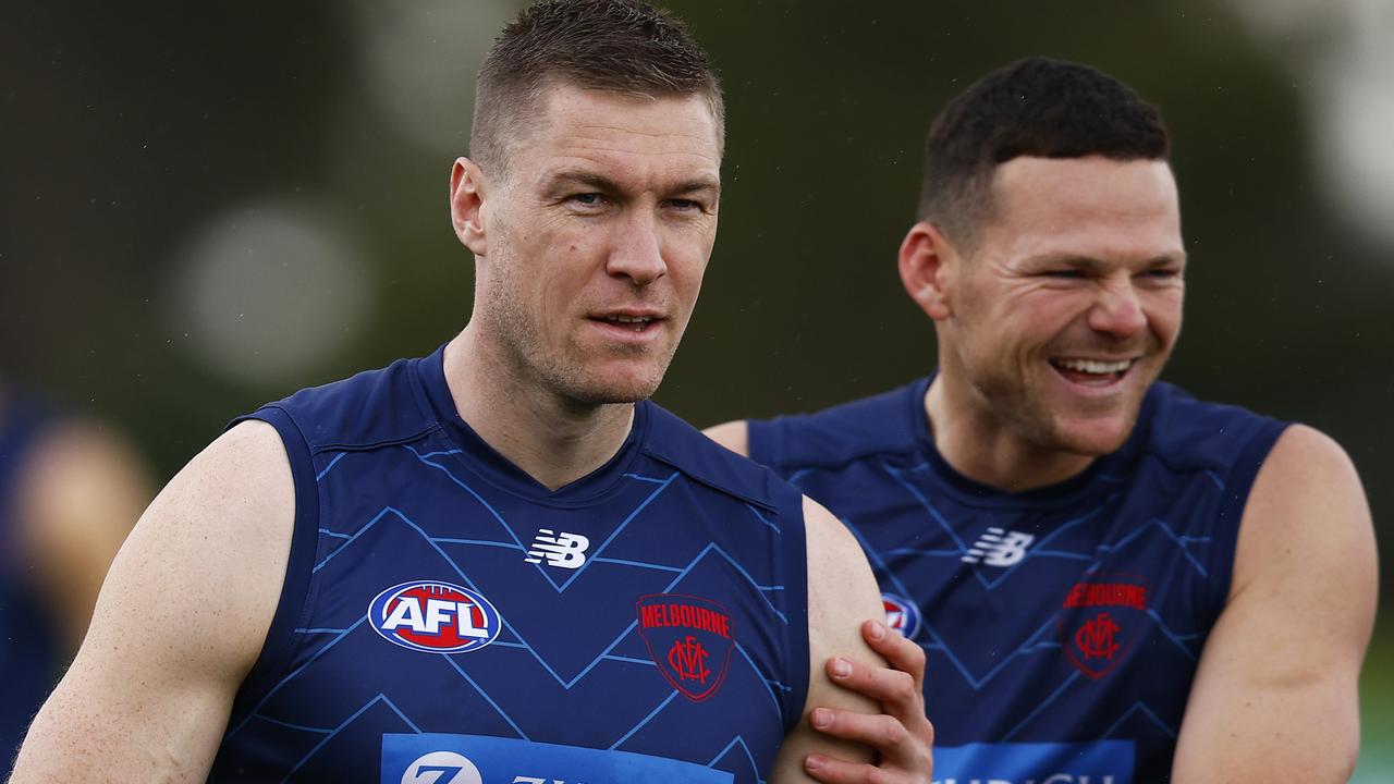 McDonald shares a laugh with Steven May on the training track last week.