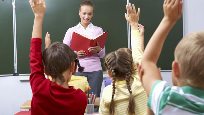 Generic image of teacher teaching students inside school classroom.