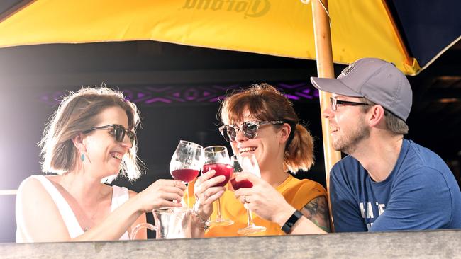 Sydney residents Jess Loader, Bianca Flanagan and Glen Loader enjoy the Darwin lifestyle at the Waterfront with a sangria in hand. Picture: Che Chorley