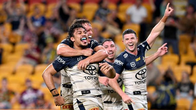 Jeremiah Nanai of the Cowboys is congratulated by teammates after scoring a try. Picture: Getty Images)