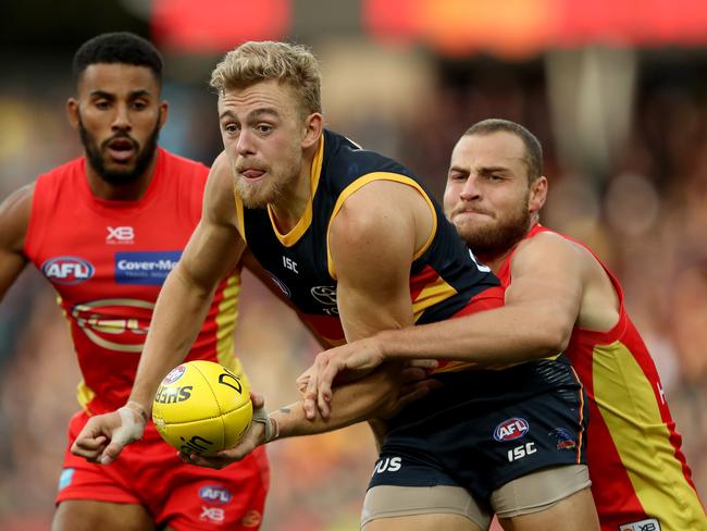 Hugh Greenwood of the Crows is tackled by Jarrod Witts of the Suns during the 2019 AFL round 05 match between the Adelaide Crows and the Gold Coast Suns at the Adelaide Oval on April 21, 2019 in Melbourne, Australia. (Photo by James Elsby/AFL Photos/Getty Images)