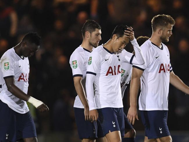 Tottenham Hotspur's Son Heung-min, second from right, and his teammates react during an English League Cup soccer match between Tottenham Hotspur and Colchester United, Tuesday, Sept. 24, 2019, at JobServe Community Stadium in Colchester, England. (Joe Giddens/PA via AP)