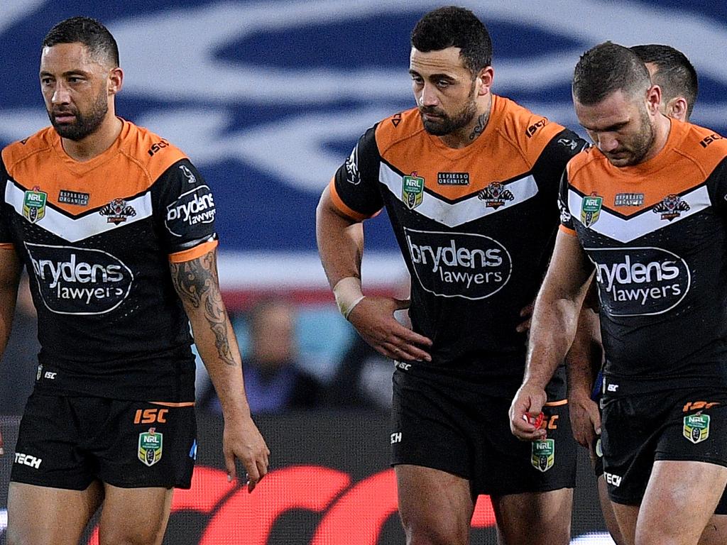 Tigers players react after conceding a try during the Round 20 NRL match between the Canterbury-Bankstown Bulldogs and the Wests Tigers at ANZ Stadium in Sydney, Friday, July 27, 2018. (AAP Image/Dan Himbrechts) NO ARCHIVING, EDITORIAL USE ONLY