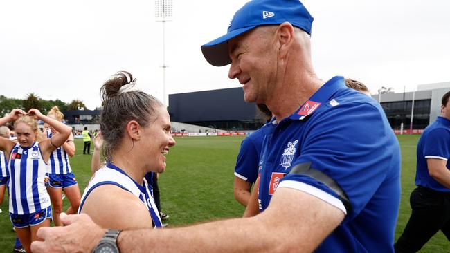 MELBOURNE, AUSTRALIA - NOVEMBER 26: Emma Kearney (left) and Darren Crocker, Senior Coach of the Kangaroos celebrate during the 2023 AFLW Second Preliminary Final match between The North Melbourne Tasmanian Kangaroos and The Adelaide Crows at IKON Park on November 26, 2023 in Melbourne, Australia. (Photo by Michael Willson/AFL Photos via Getty Images)