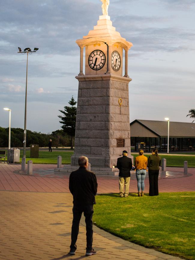 People pay their respects at the war memorial on the foreshore at Semaphore. Picture: AAP/Morgan Sette