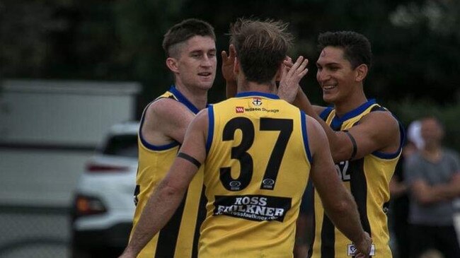 Durras Seccull (left) celebrates one of his four goals for the Zebras.