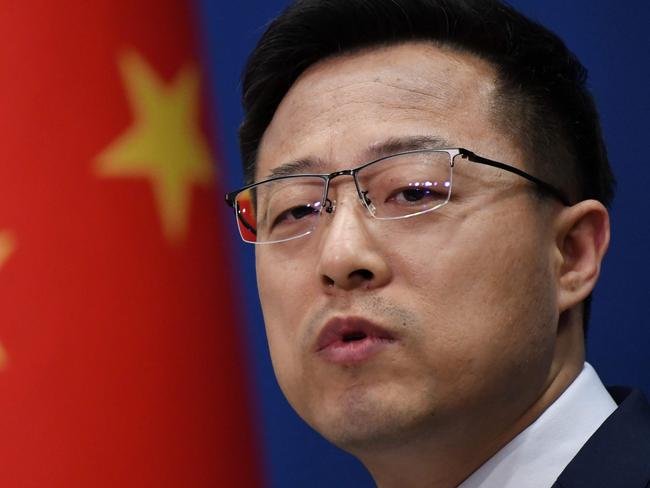 Chinese Foreign Ministry spokesman Zhao Lijian speaks at the daily media briefing in Beijing on April 8, 2020. (Photo by GREG BAKER / AFP)