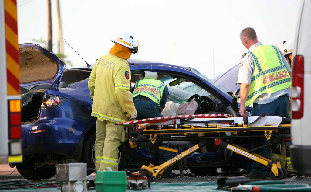 Woman trapped in collision | The Courier Mail