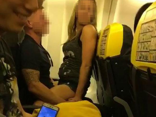 The two passengers get raunchy in full view of other passengers. Picture: SWNS/Mega