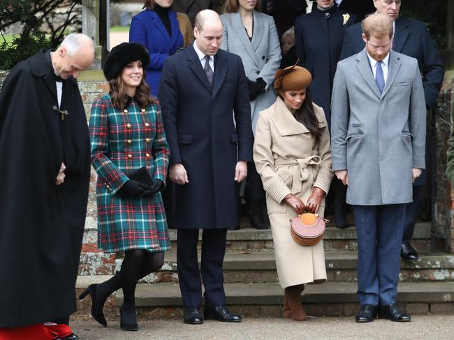 Prince William, Duke of Cambridge, Prince Philip, Duke of Edinburgh, Catherine, Duchess of Cambridge, Meghan Markle and Prince Harry, as Kate and Meghan curtsy in front of the Queen. Picture: Getty