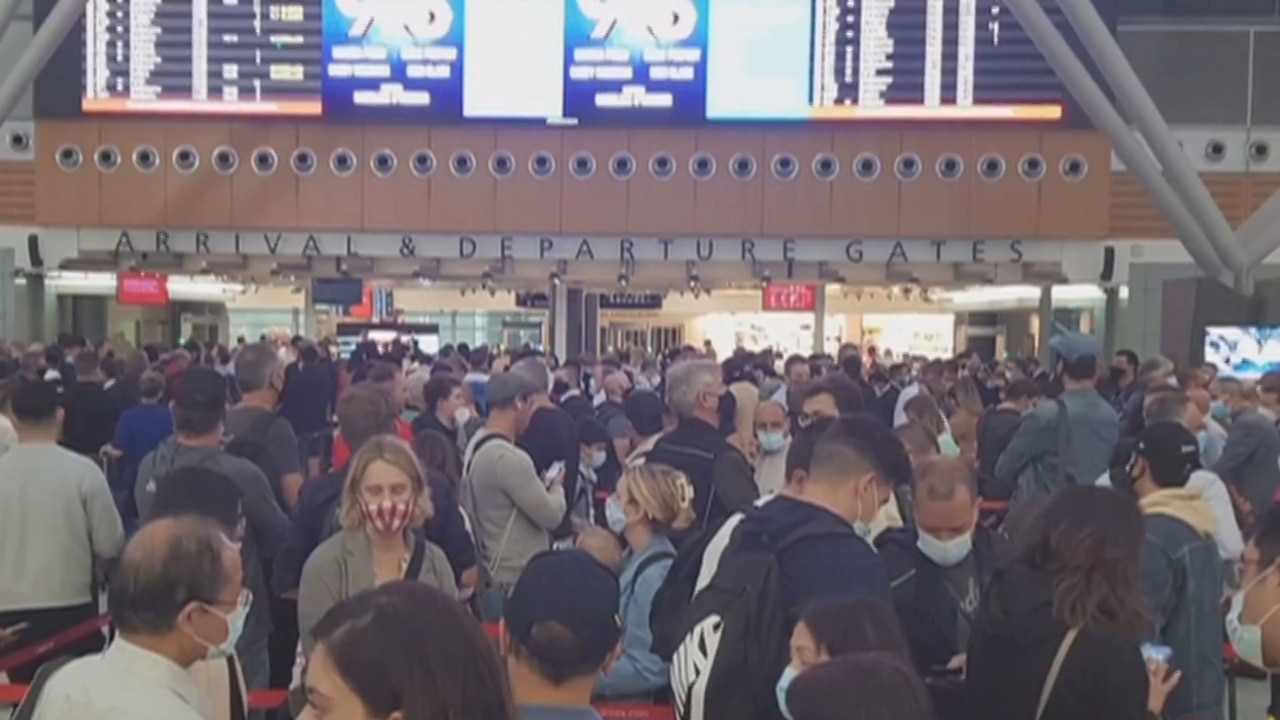 Passengers endure long queues at airport