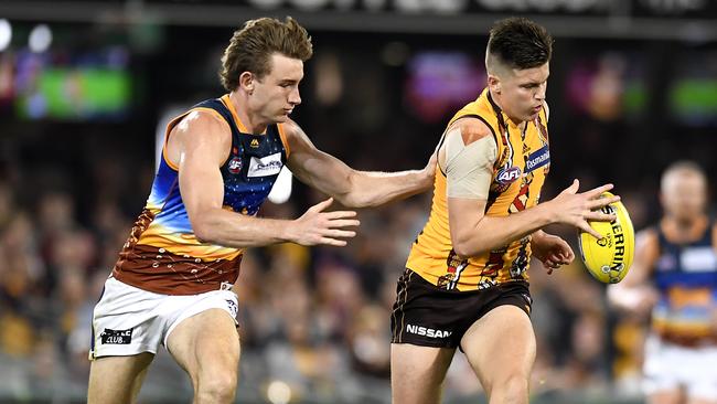 Harris Andrews (left) was a wall for the Lions for much of the night, while young Hawk Mitchell Lewis did some nice things. Pic: Getty Images