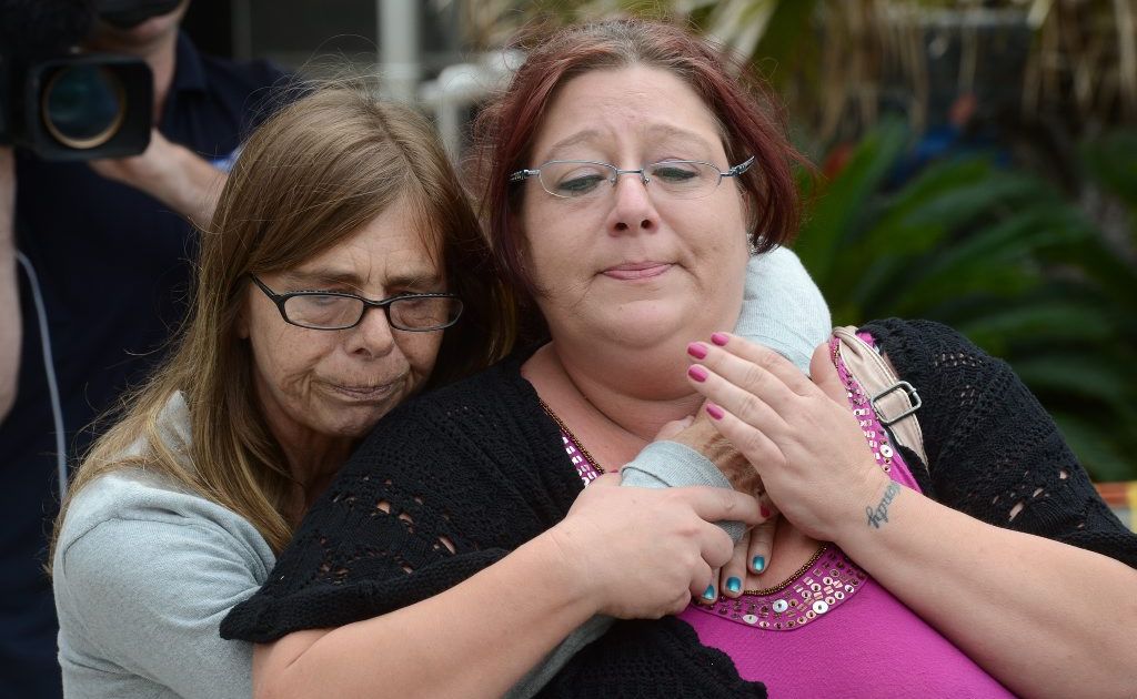 Debbie Sneddon (left), close friend of murdered nurse Wendy Evans, hugs Michelle Tuifufu (right), sister of Wendy Evans as they leave the Toowoomba courthouse. Picture: DAVE HUNT