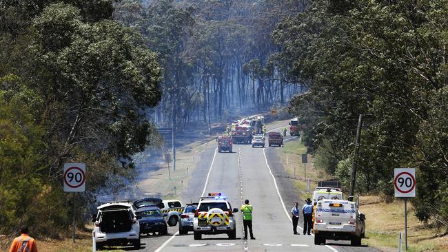 A fatal car crash has sparked an out of control bush fire south of Kurri Kurri at Pelaw Main. Picture: Peter Lorimer.