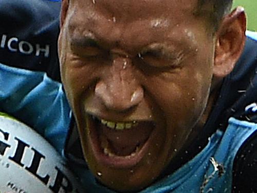 Waratahs player Israel Folau crosses over to score a try during the round 5 Super Rugby match between the Queensland Reds and the New South Wales Warratahs at Suncorp Stadium in Brisbane , Sunday, March 27, 2016. (AAP Image/Dave Hunt) NO ARCHIVING, EDITORIAL USE ONLY