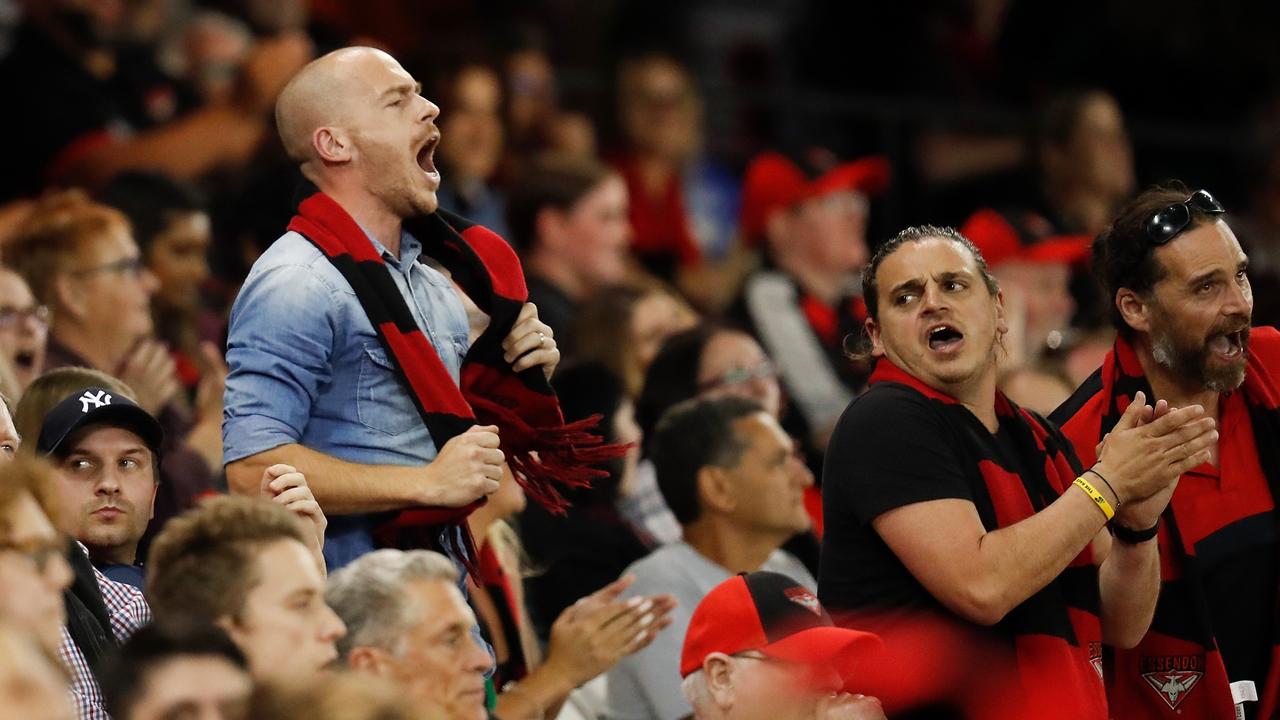 Bombers fans enjoy being back at the footy.