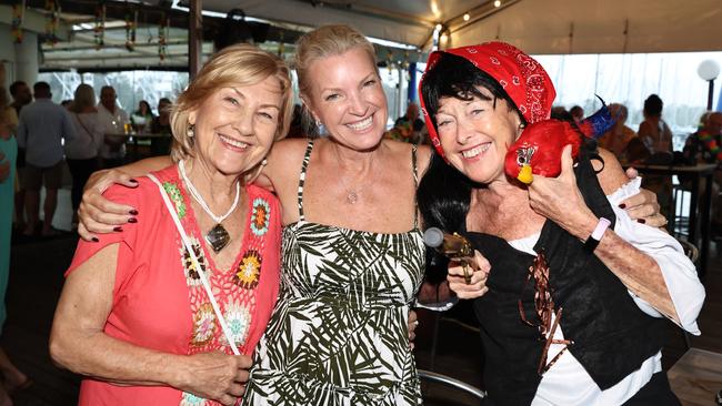 The Barbary Coasters have performed their popular Parrothead Party, playing the tropical rock music of the late Jimmy Buffett to hundreds of fans at the Yorkeys Knob Boating Club. Faye Hartman, Jenna Shingles and Susie White at the Parrothead Party. Picture: Brendan Radke
